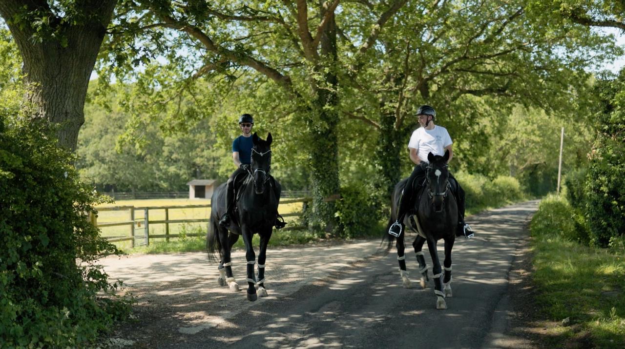 Chris and Joe riding horses in the Kent countryside
